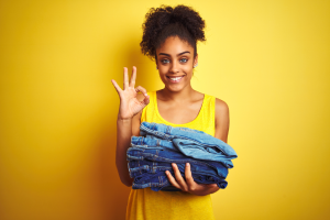 Girl With Laundry Basket Holding Jeans Okay Sign 300X200